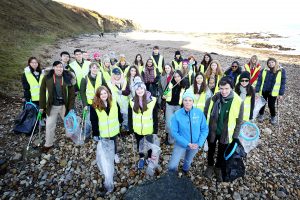 Litter pickers on the beach